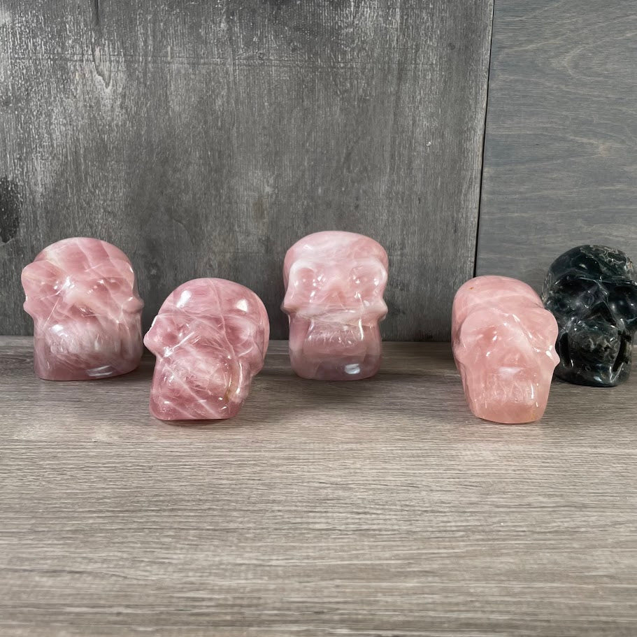 Bulk carved crystal skulls in various gemstones