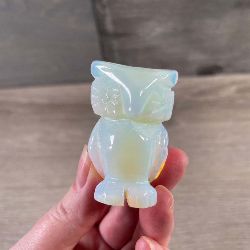 Opalite crystal owl carving symbolizing wisdom and intuition