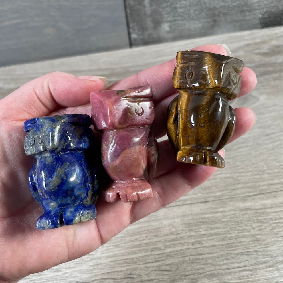 Assorted crystal owl figurines carved from gemstones