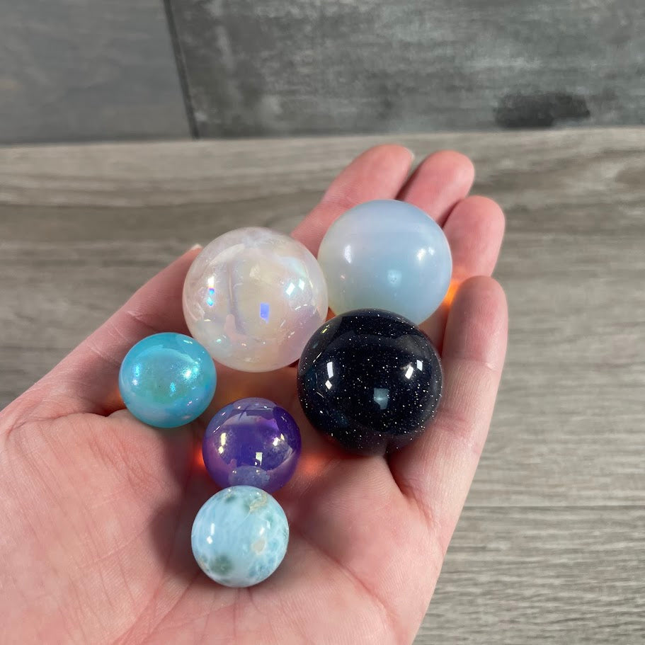 Assorted gemstone crystal spheres wholesale in mixed sizes