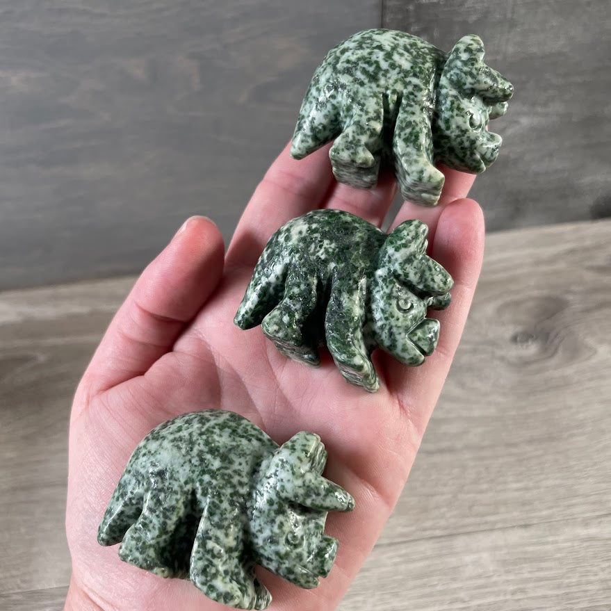 Tree Agate crystal animal carving featuring a prehistoric triceratops