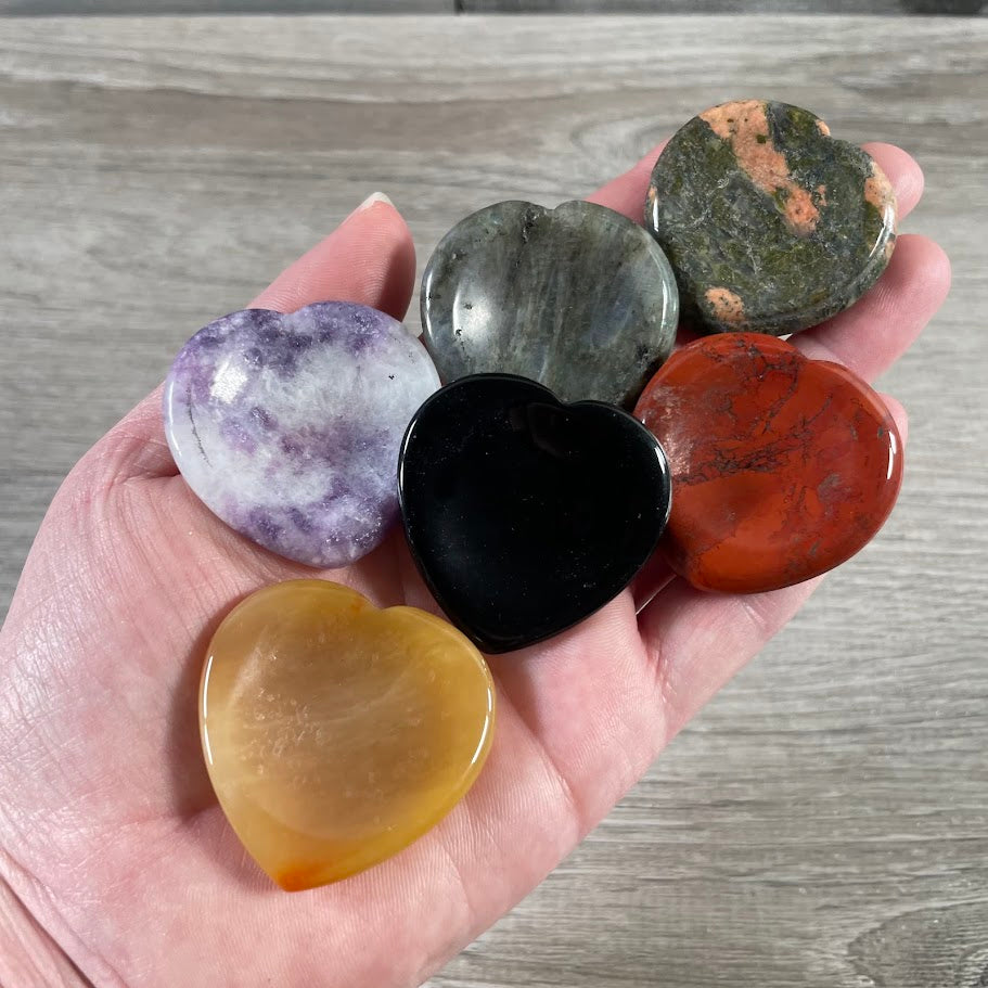 assorted polished crystal heart pocket stones