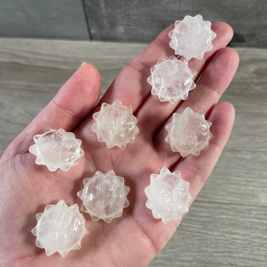 Quartz crystal sun face carvings for gift shops, boutiques, and spiritual stores