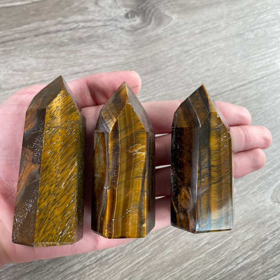 Brazilian crystal obelisk tiger eye sold by the ounce for wholesale metaphysical products