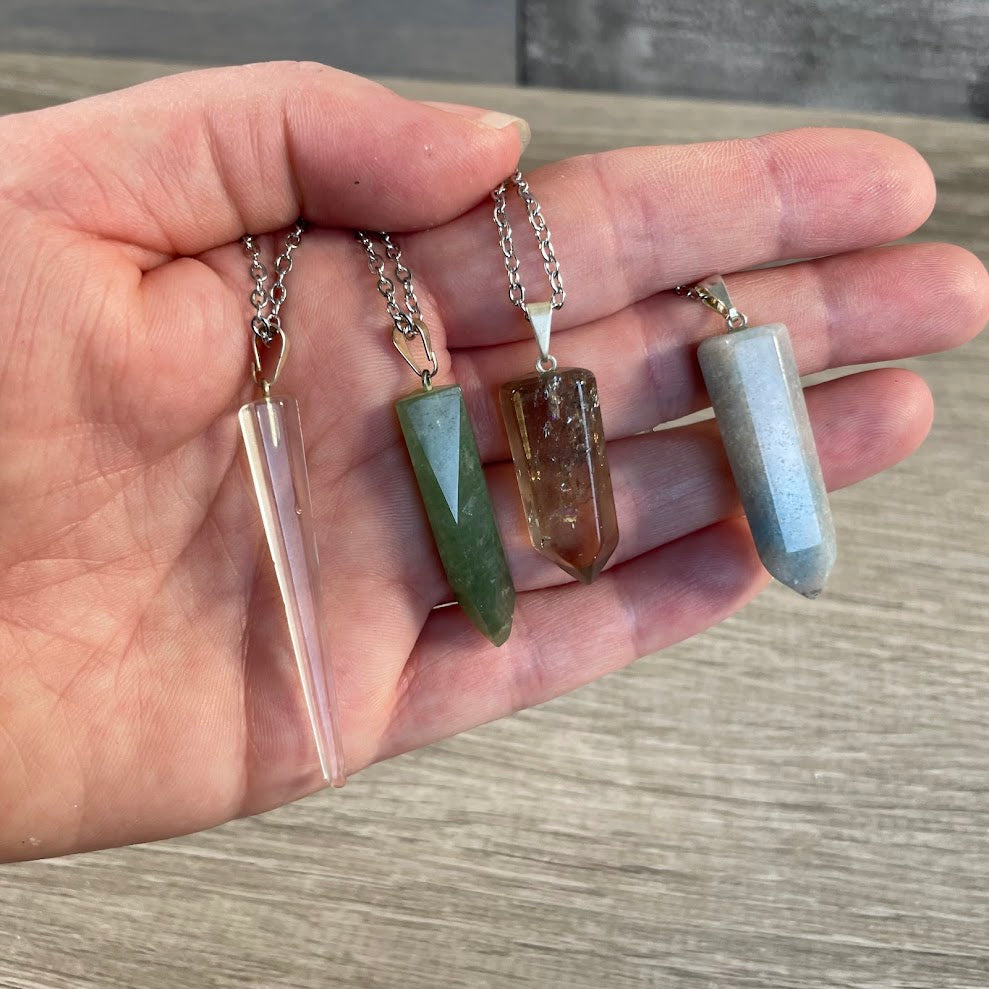 assorted crystal point necklace on stainless steel chain