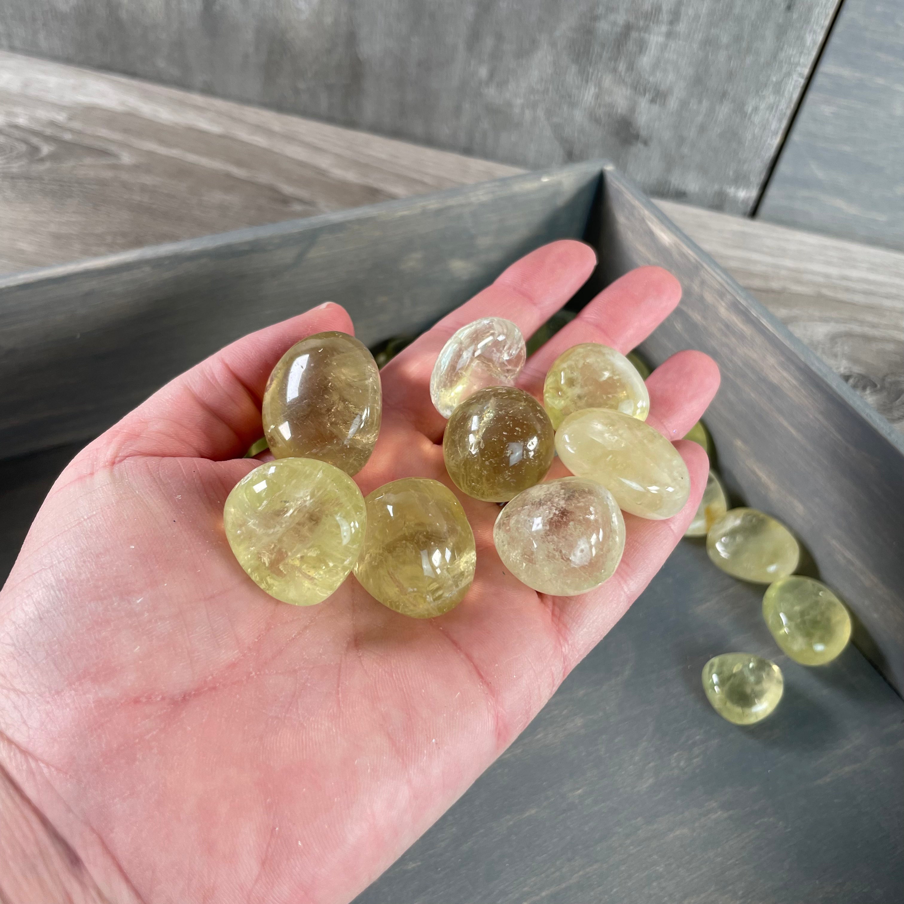 Vibrant yellow Lemon Citrine tumbled stones sold by the pound for wholesale and resale markets.