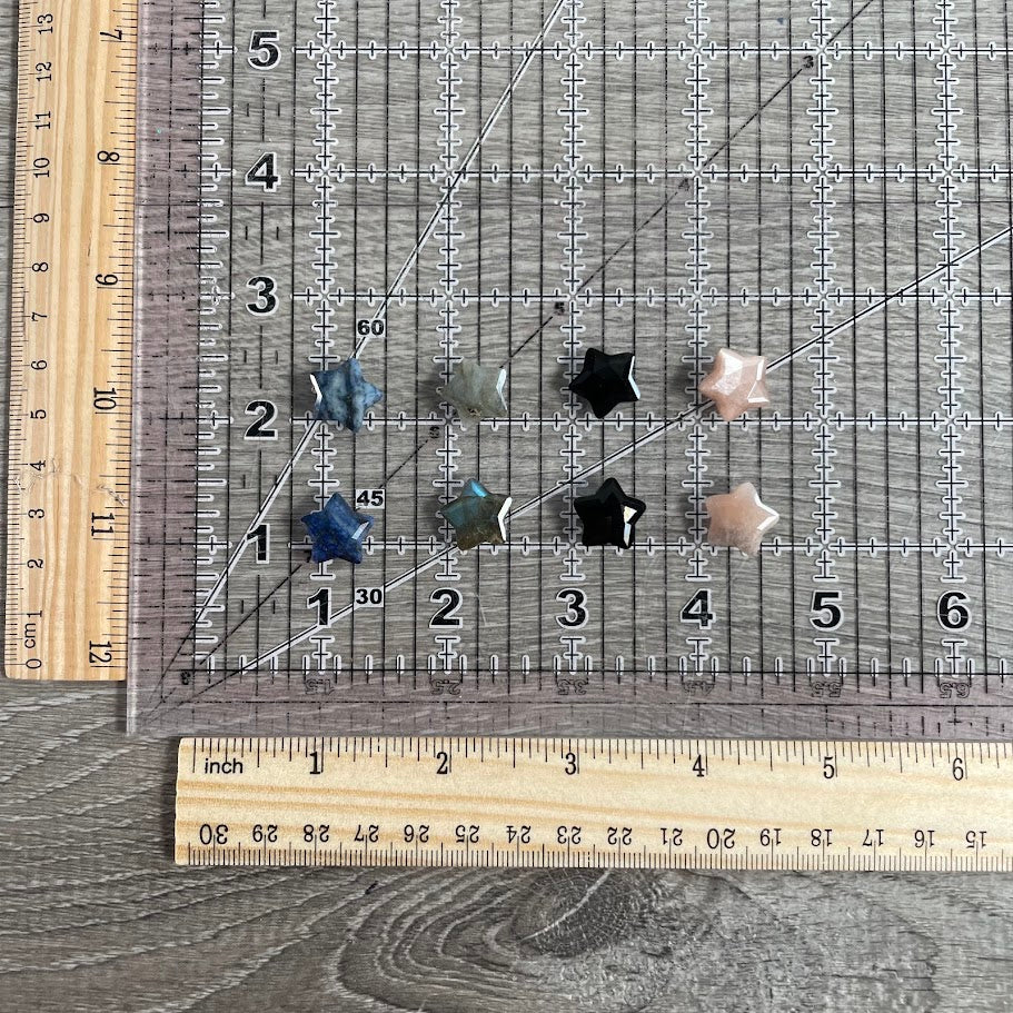 Assorted variants with grid and rulers for size reference. Labradorite, sodalite, obsidian, and moonstone. 