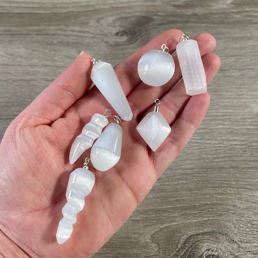 assorted selenite pendants for rock shops
