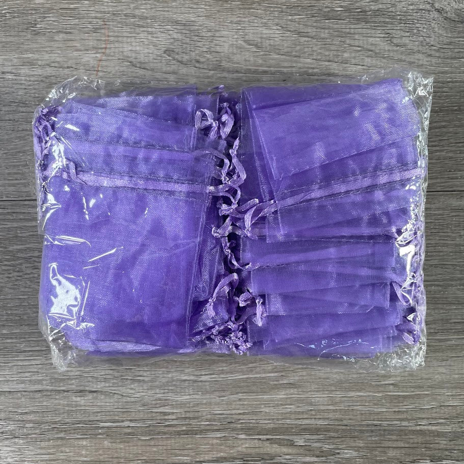 Elegant sheer organza gift bags for crystals, jewelry, and metaphysical shop packaging.