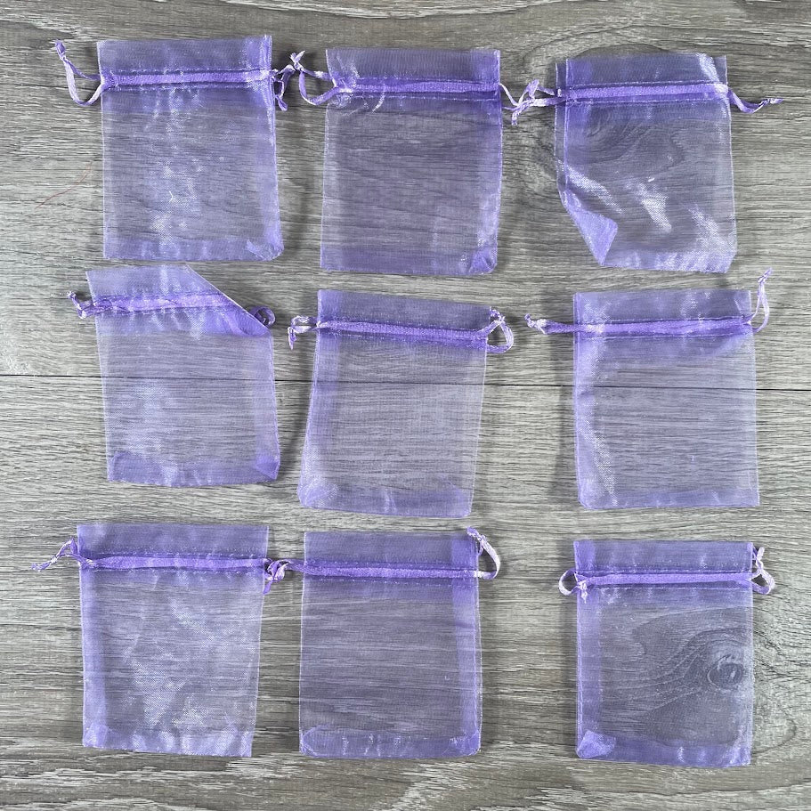 Wholesale sheer fabric gift bags for jewelry, party favors, and retail packaging.