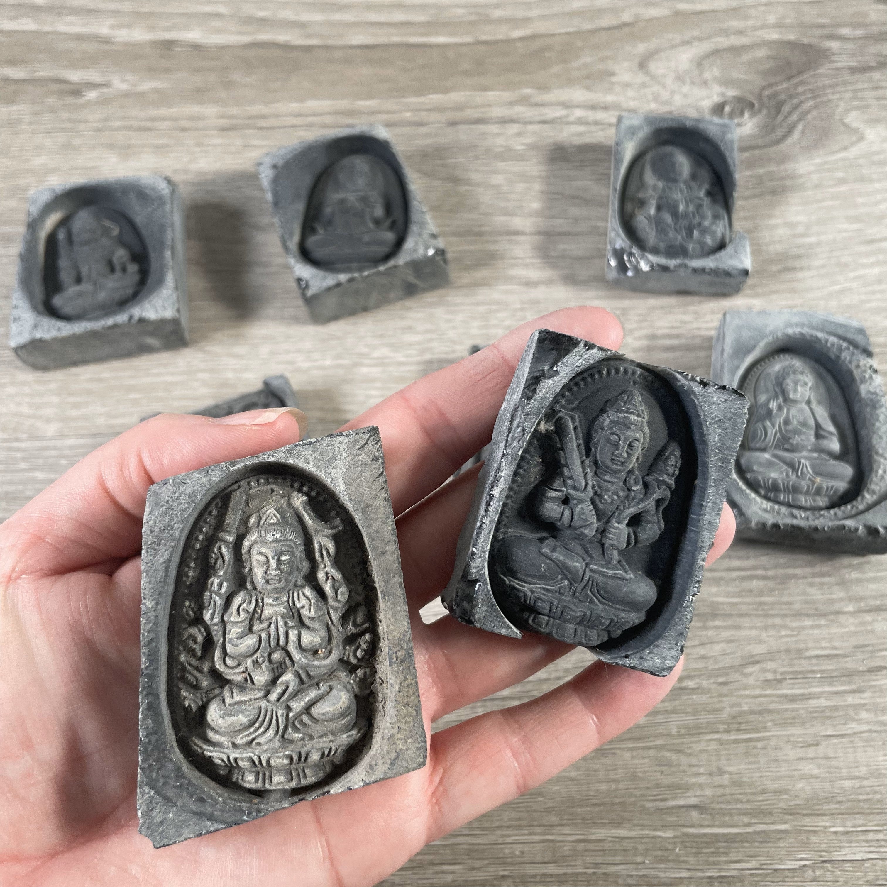 Black obsidian carved tile featuring sacred deities for resale
