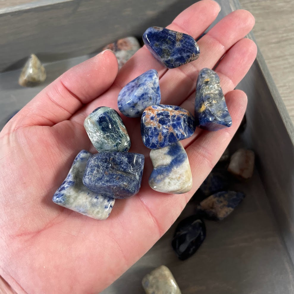 blue sodalite crystal pile tumbled stones bulk