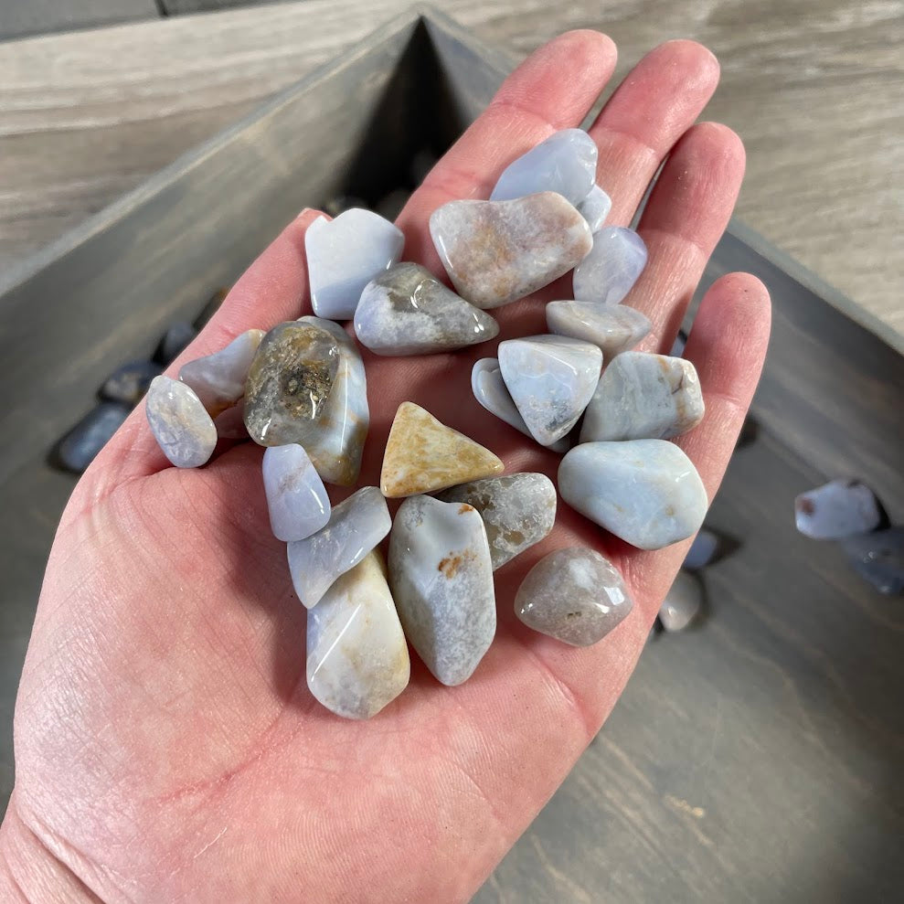 bulk chalcedony crystals soft blue polished gemstones