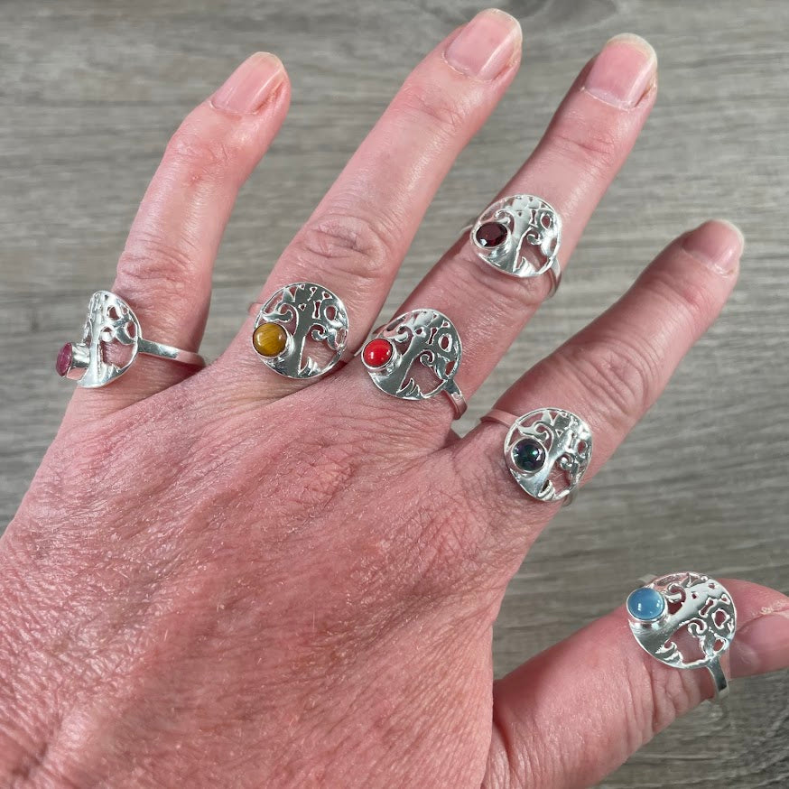 Assorted sterling silver rings with healing crystals