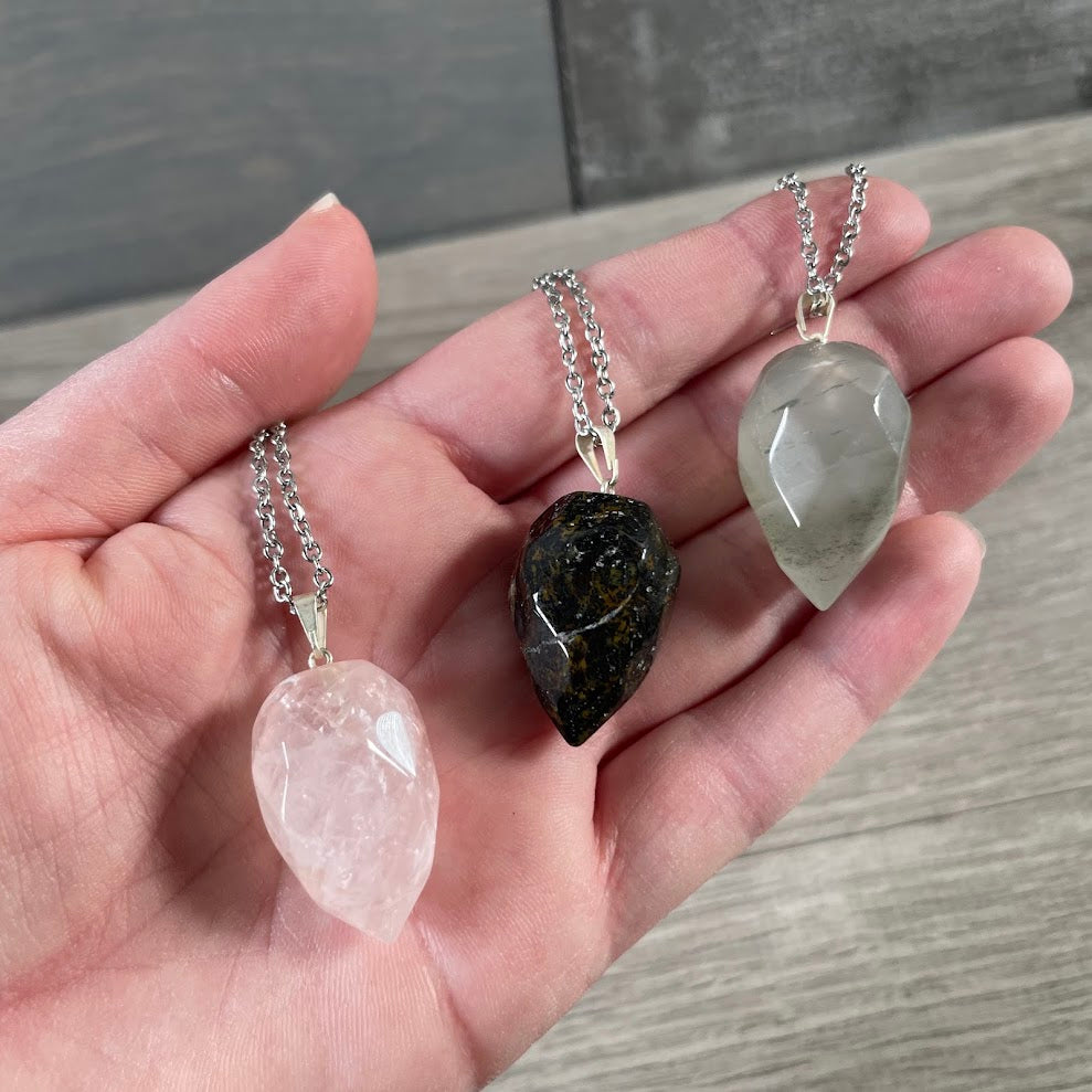 assorted gemstone flame pendants metaphysical jewelry