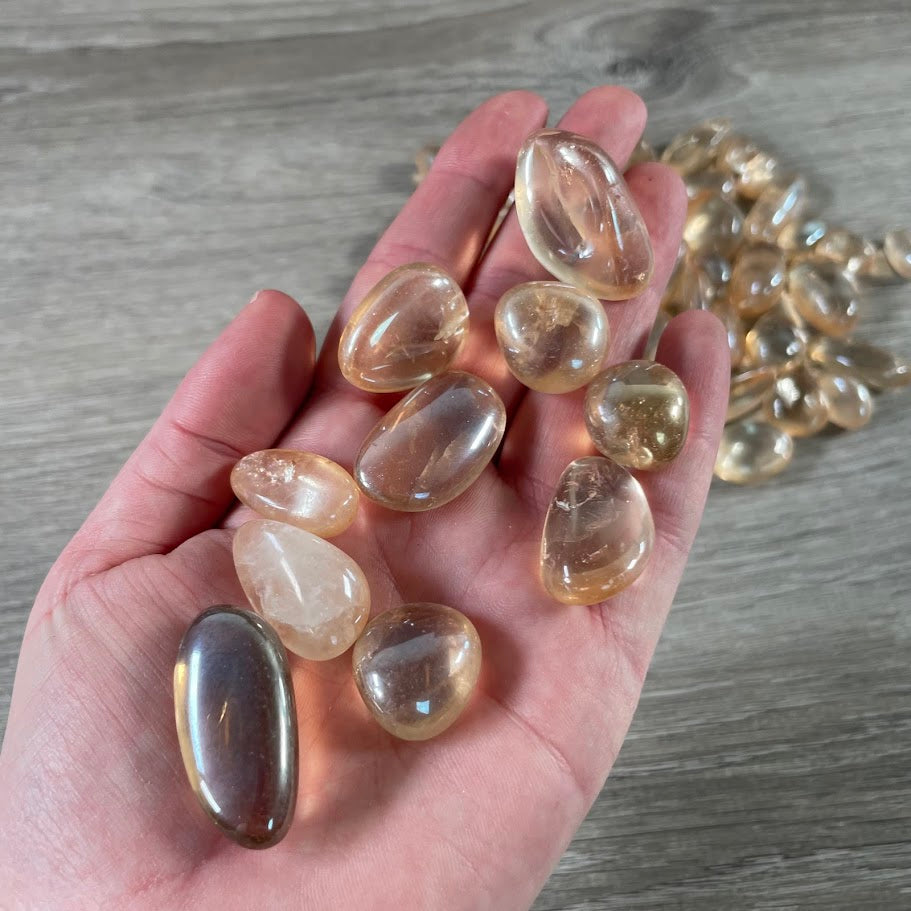 Bulk tumbled Tangerine Aura Quartz stones wholesale
