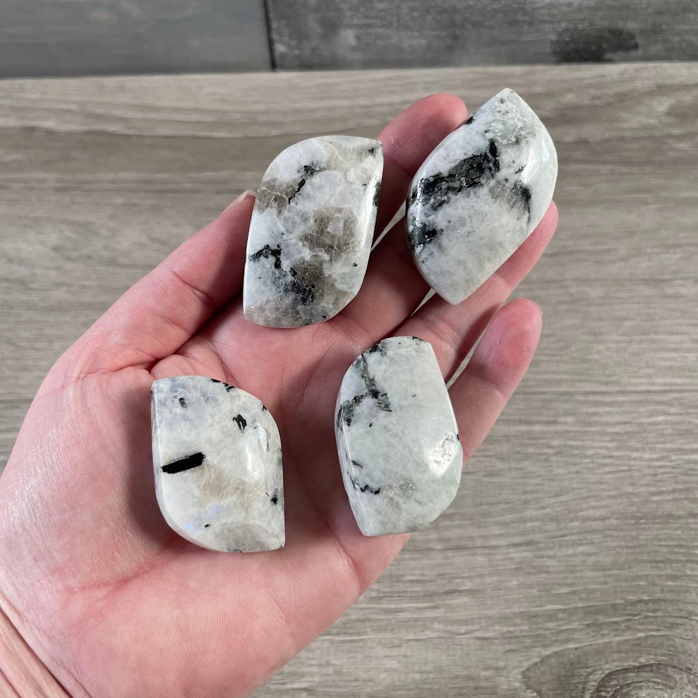 Wholesale polished Rainbow Moonstone Freeform with natural black tourmaline