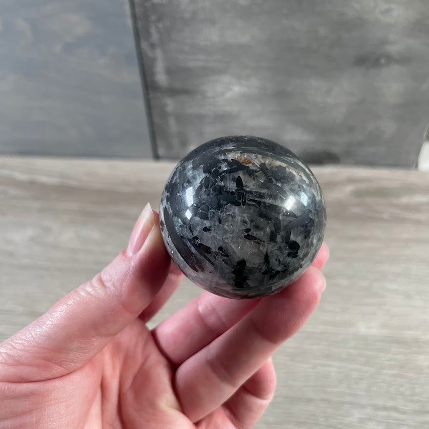 Polished tourmalinated quartz crystal ball for wholesale crystal shops