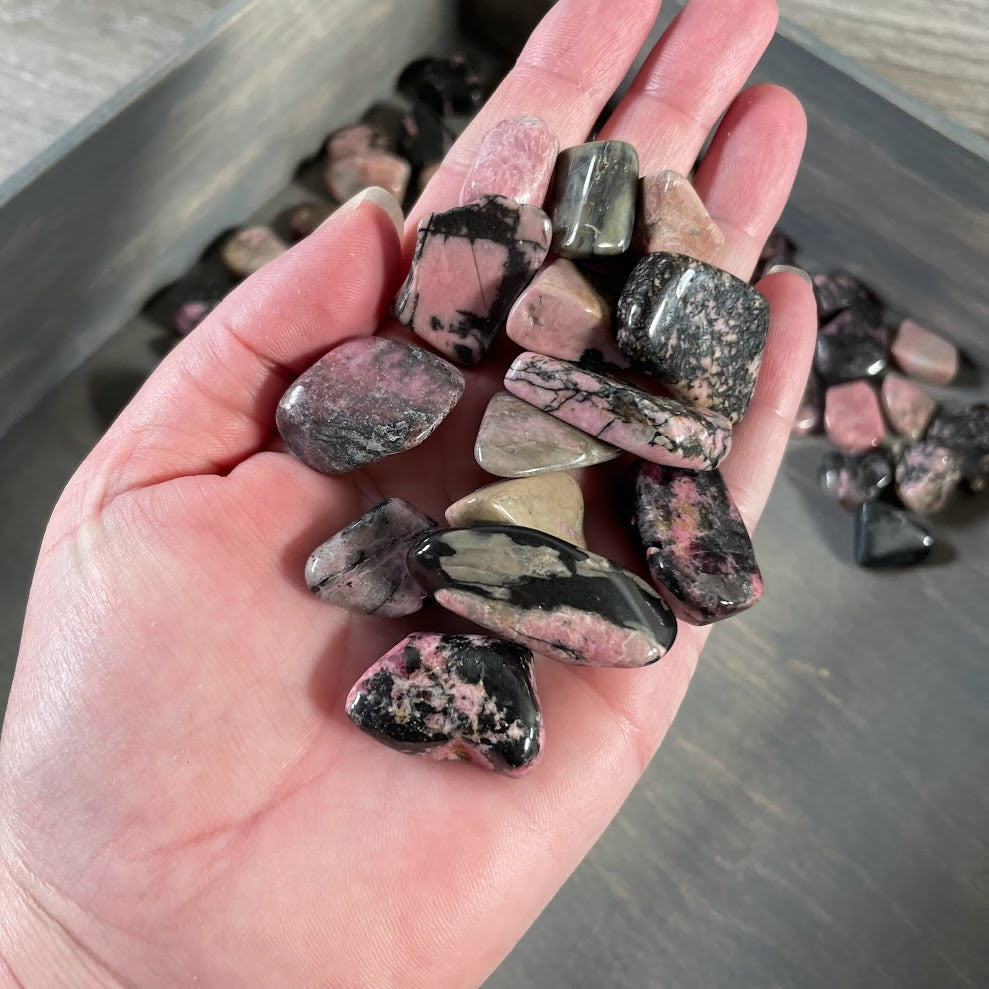 Rhodonite tumbled stones in a 1 pound bulk lot for crystal shops and resale