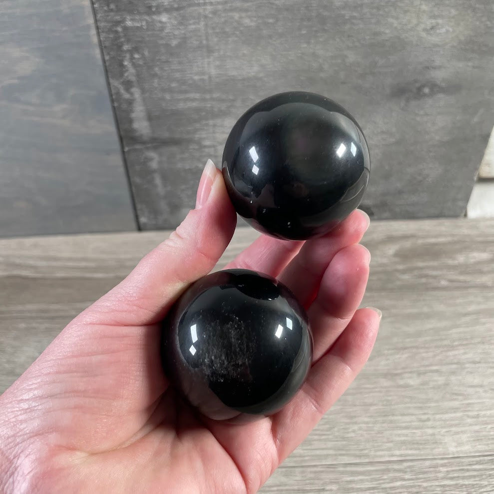 Smooth black obsidian crystal ball for altar, meditation, and retail display