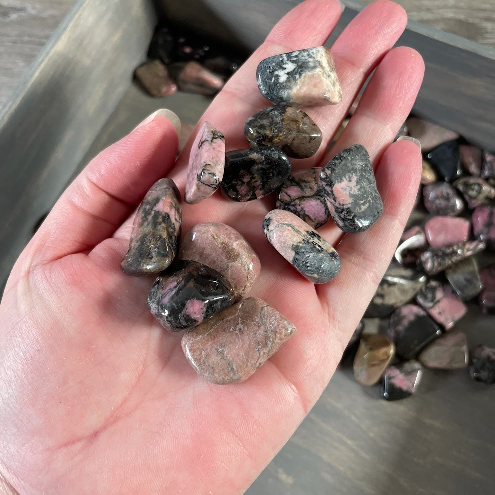 Pink rhodonite polished stones with black matrix for wholesale crystal inventory