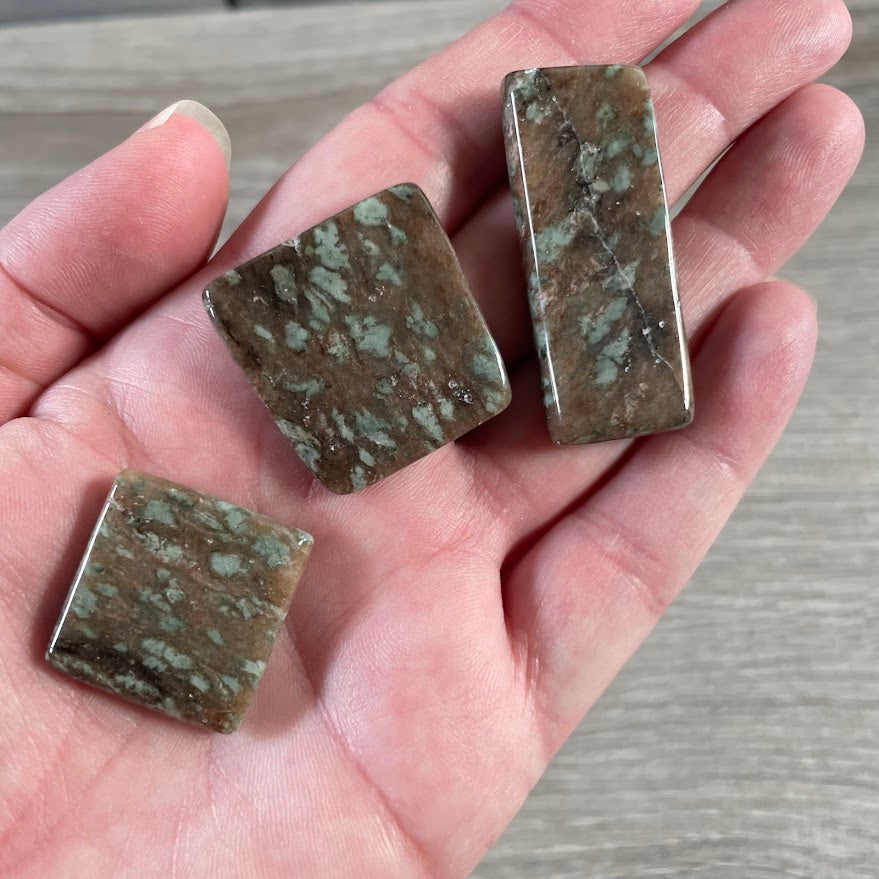 Smooth polished Nundoorite gemstone slab with organic stone patterns