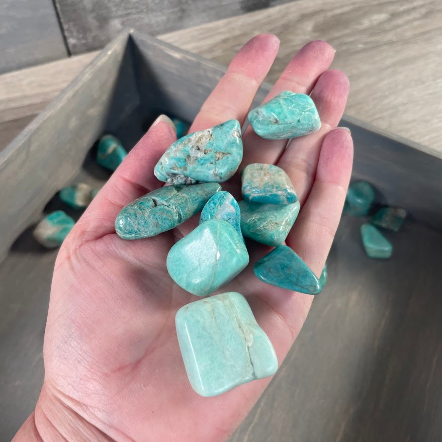 Bulk Amazonite tumbled stones with smooth polished surfaces for wholesale crystal shops and gemstone retailers
