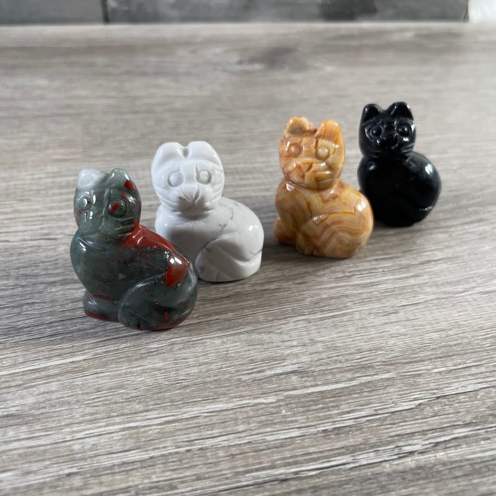 Crystal cat figurines in mixed gemstones for cat lovers, boutiques, and gift retailers.