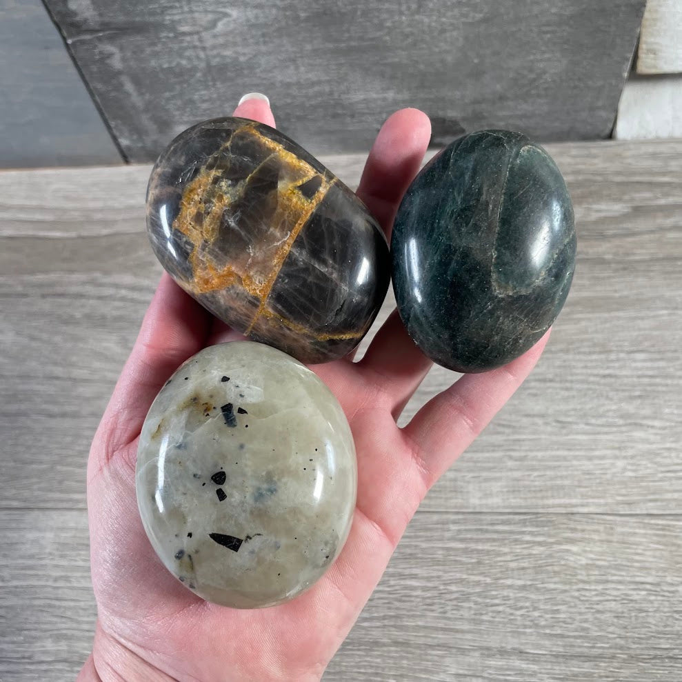 Wholesale polished crystal palm stones by the ounce for rock shops and crystal retailers