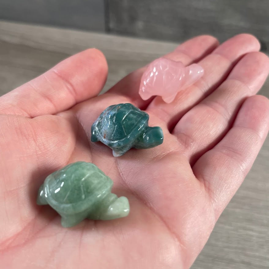 Assorted crystal turtle animal carvings made from natural gemstones