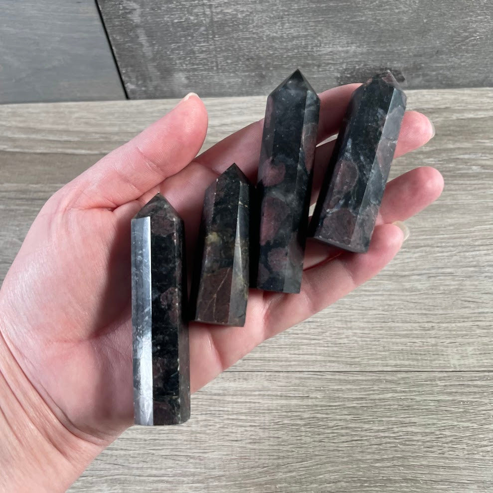 Black and red astrophyllite with garnet small obelisk bulk wholesale