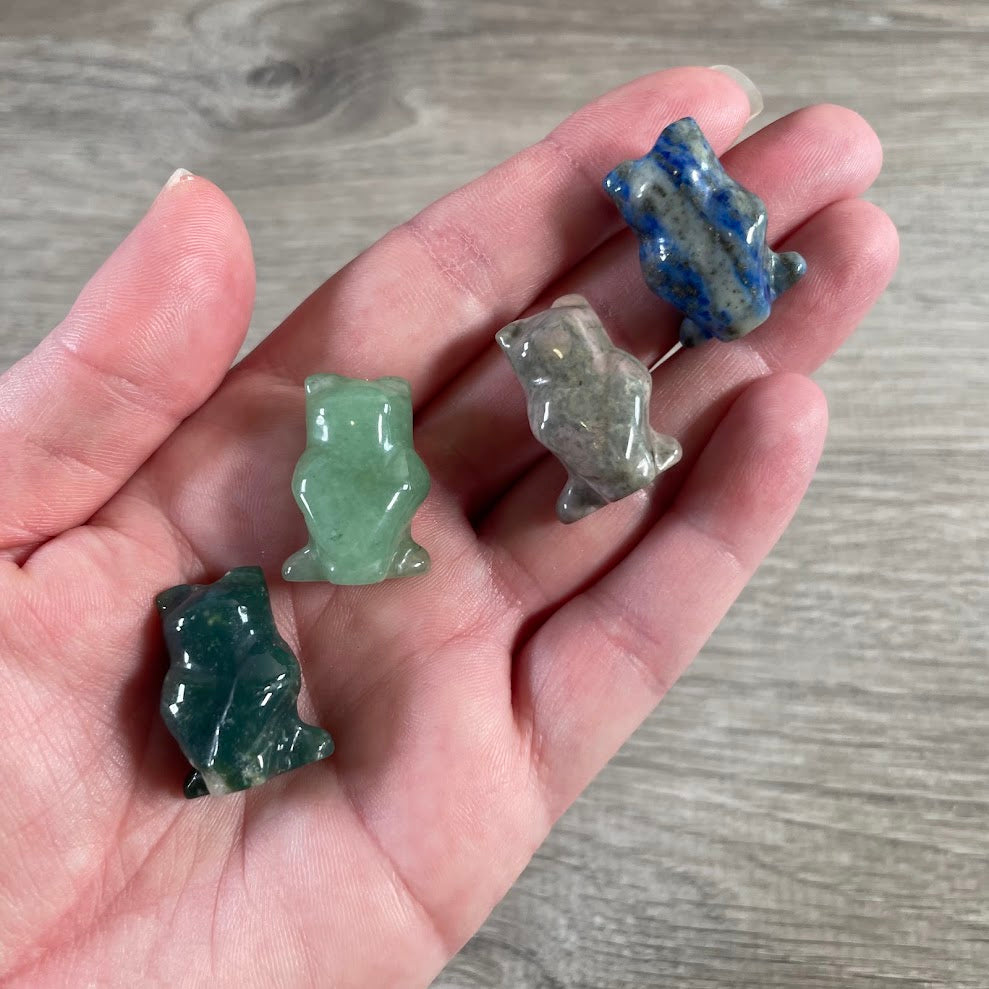 back side of small owl figurines