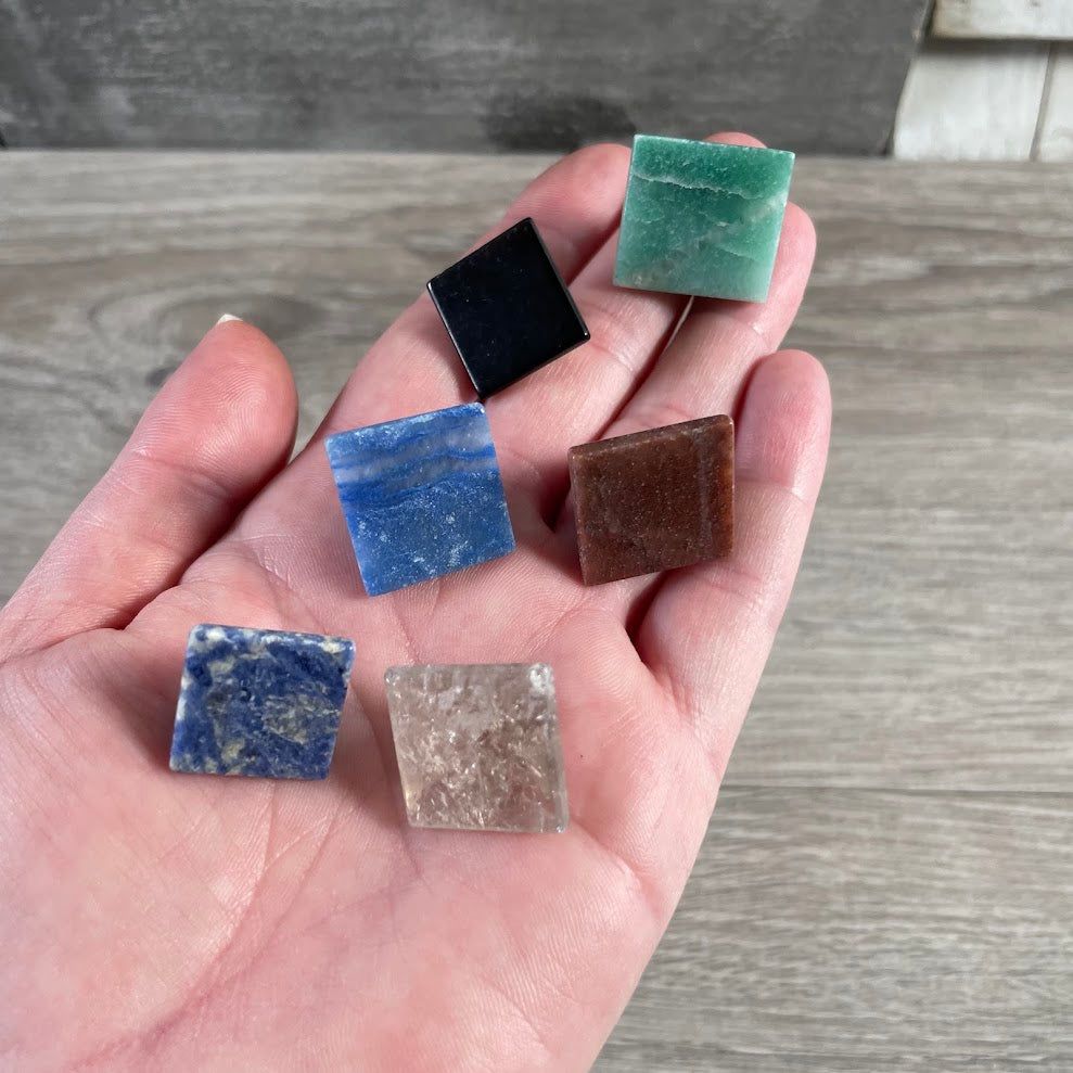 back side of assorted gemstone pyramids