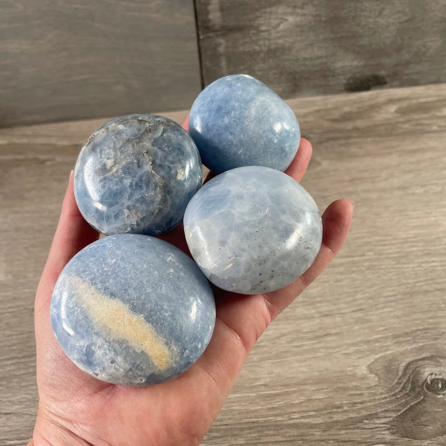Smooth polished blue calcite crystal palm stones for wholesale gemstone and gift shops
