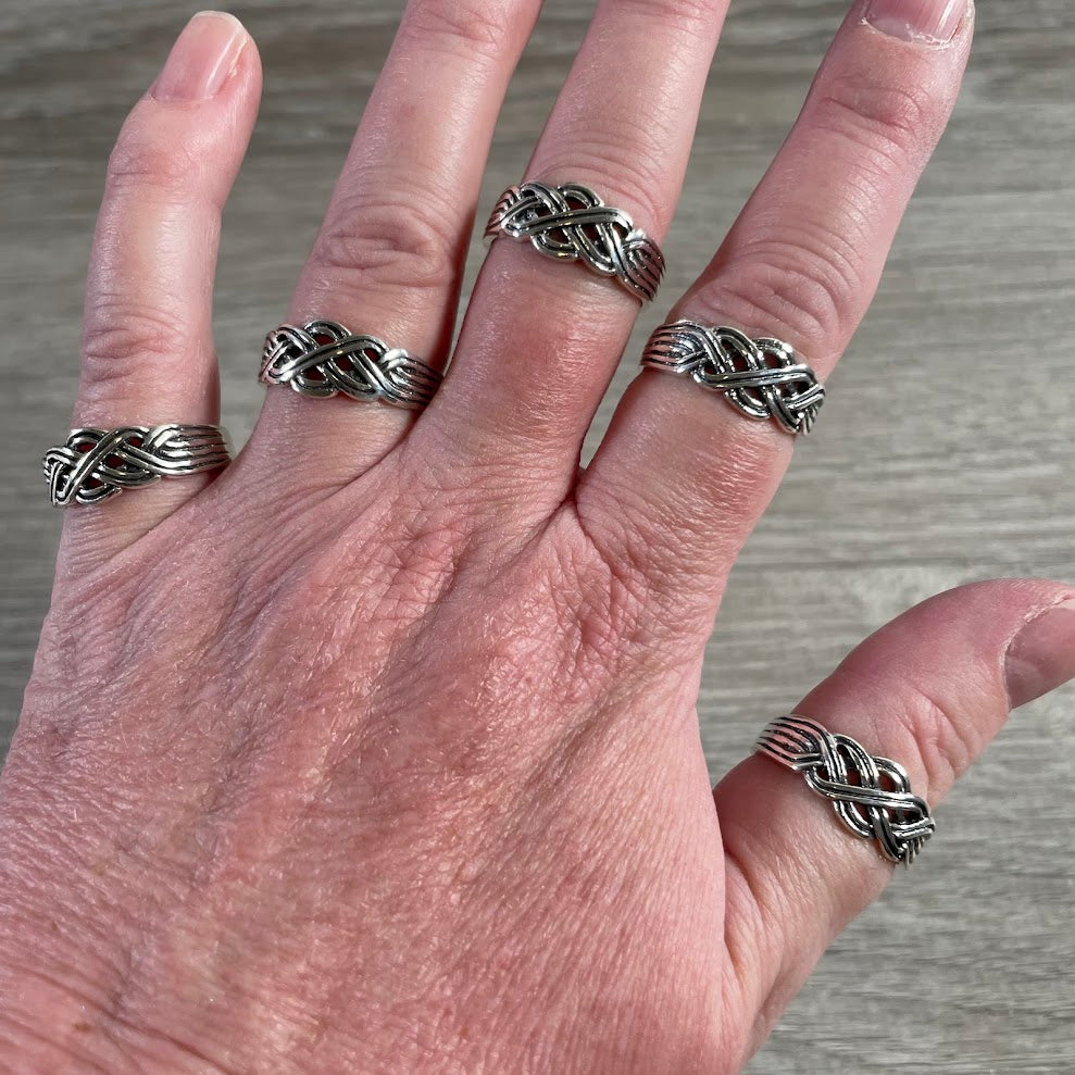 Celtic knot sterling silver band with woven infinity pattern for retail jewelry displays