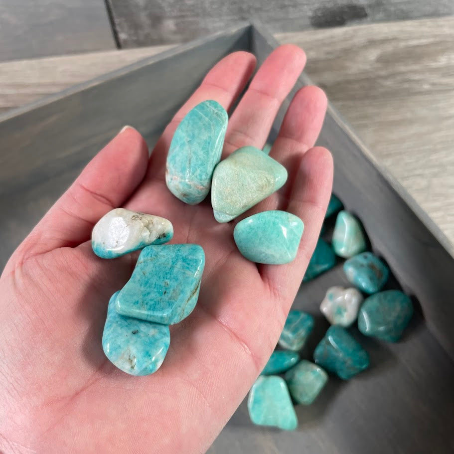 Assorted Amazonite tumbled gemstones sold by the pound for wholesale crystal and metaphysical retailers