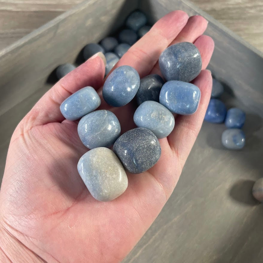Bulk tumbled blue quartz polished gemstones sold by the pound for crystal shops and gemstone retailers