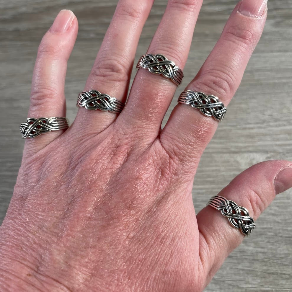 Wholesale sterling silver Celtic knot ring featuring intricate interwoven silver band