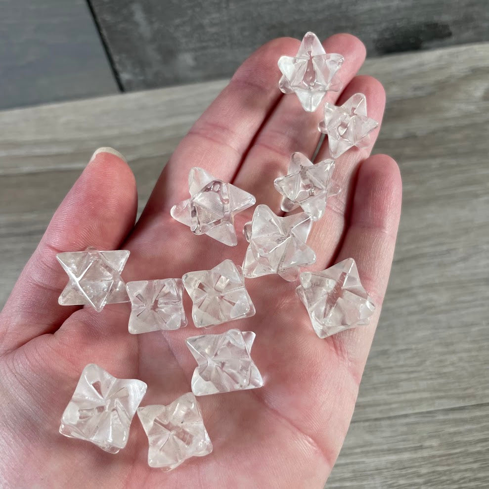 Clear quartz polished Brazilian crystal Merkaba carvings featuring assorted gemstone sacred geometry stars