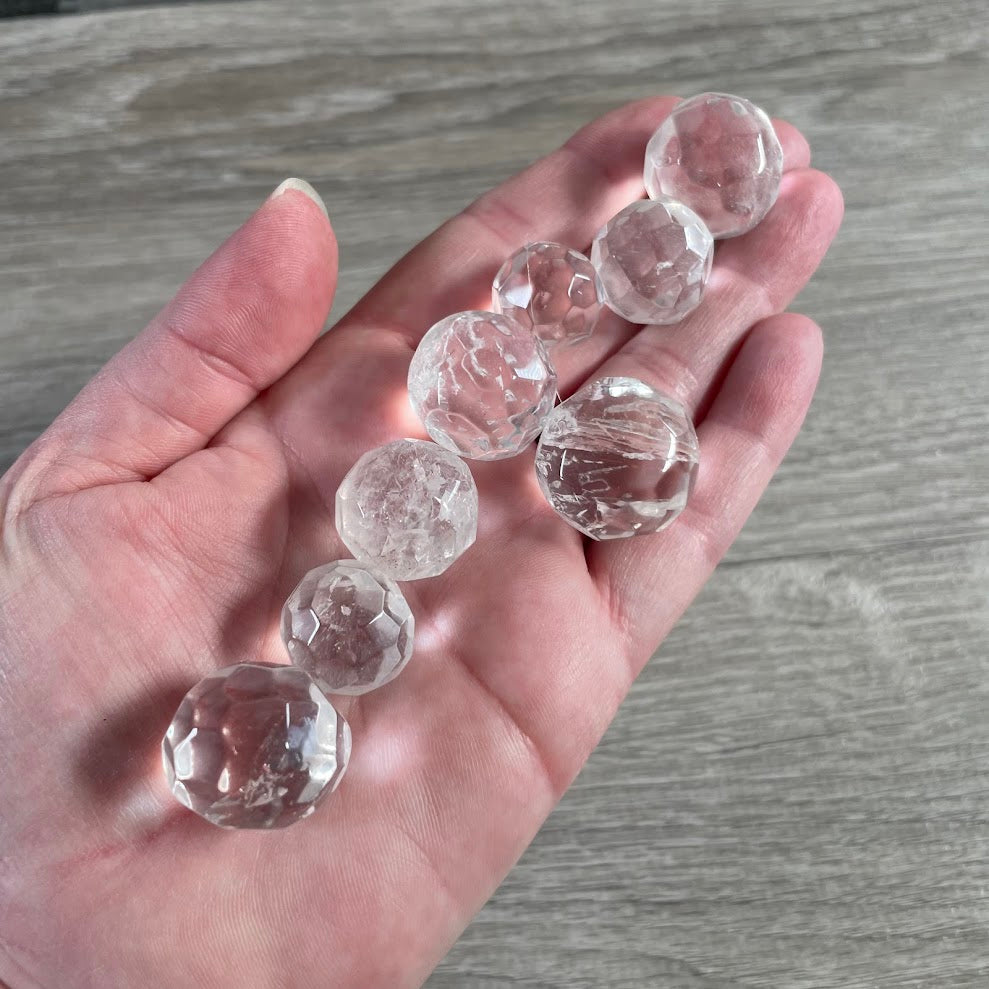 clear quartz small faceted crystal ball made from polished natural gemstone
