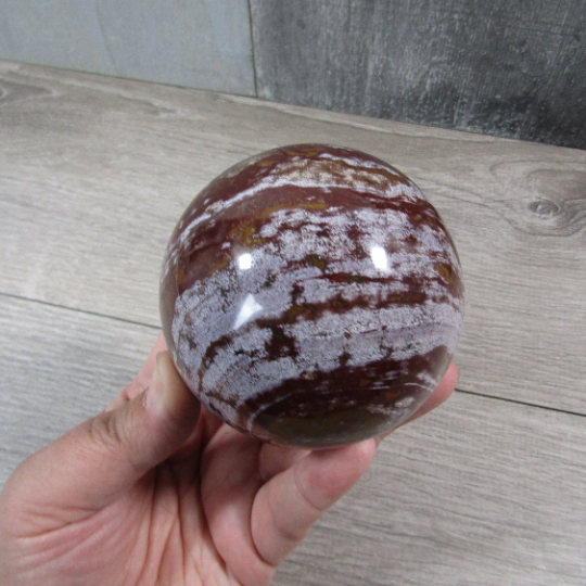 Ocean jasper display sphere highlighting unique circular patterns