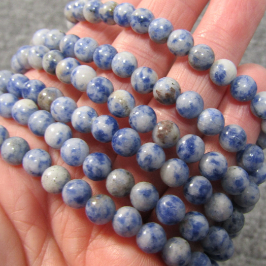 Stretchy bracelet made from 6mm round blue spot jasper beads