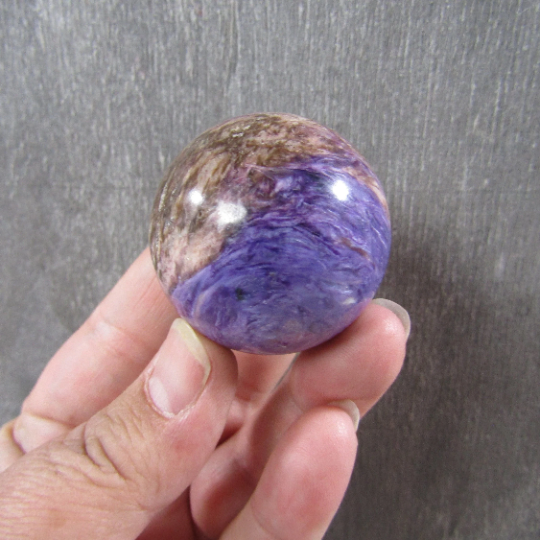 Premium Charoite Crystal Sphere – Spiritual Healing & Decor.