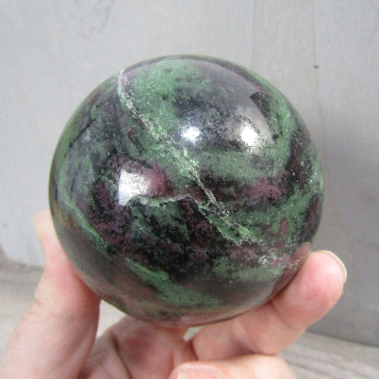 Large ruby in zoisite display sphere with vibrant green and red colors