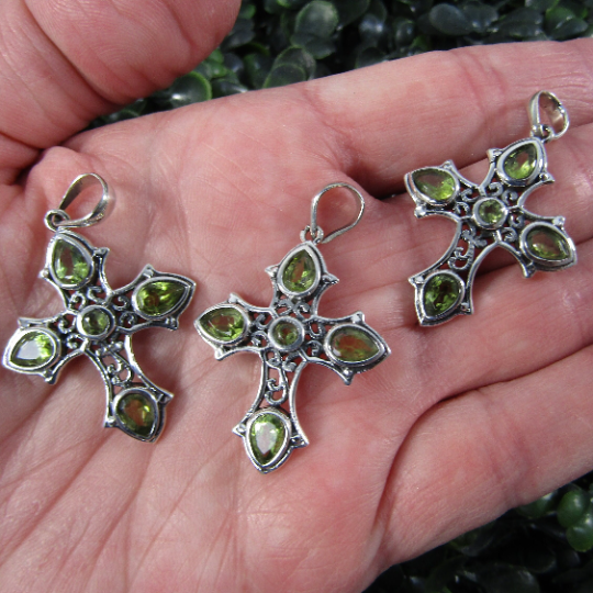 Intricate sterling silver gemstone cross pendant with peridot accent