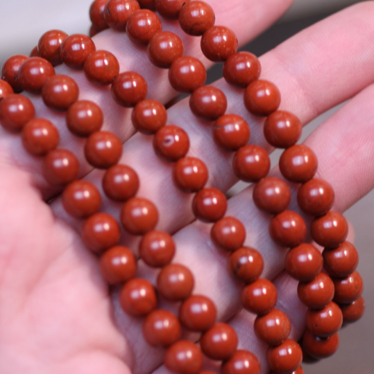 Stretchy bracelet made from 6mm round red jasper beads