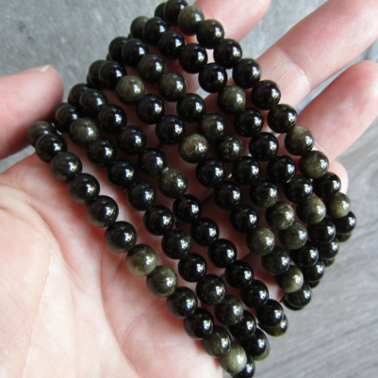 Stretchy bracelet made from 6mm round sheen obsidian beads