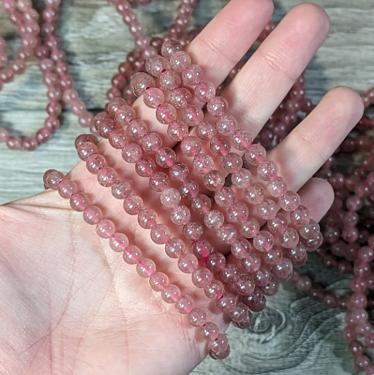 Stretchy bracelet made from 6mm round strawberry quartz beads