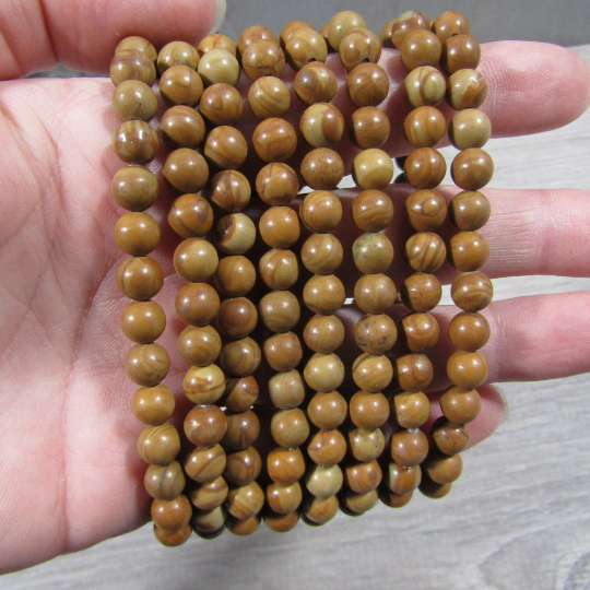 Stretchy bracelet made from 6mm round wood lace agate beads