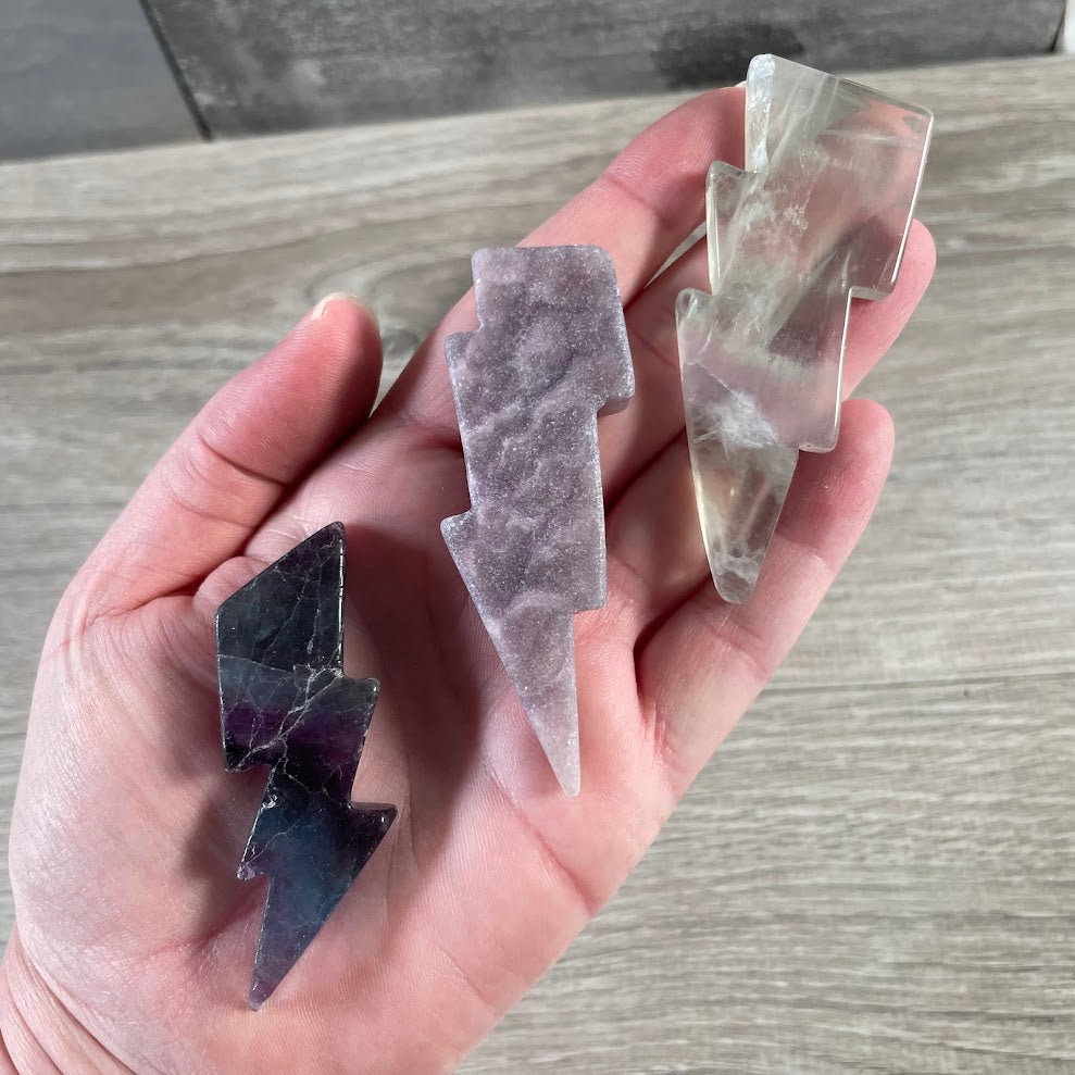 Assortment of fluorite gemstone lightning bolt carvings for wholesale crystal retailers